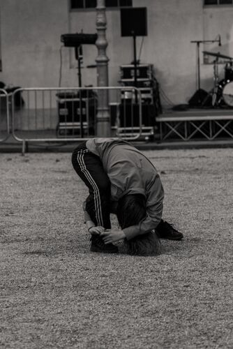 A dancer leaning towards her leg
