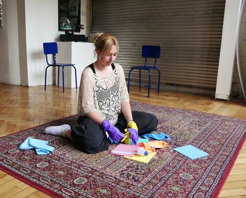 A women sitting on a carpet